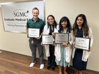 Resident physicians with plaques