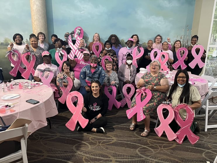 women at a pink ribbon event